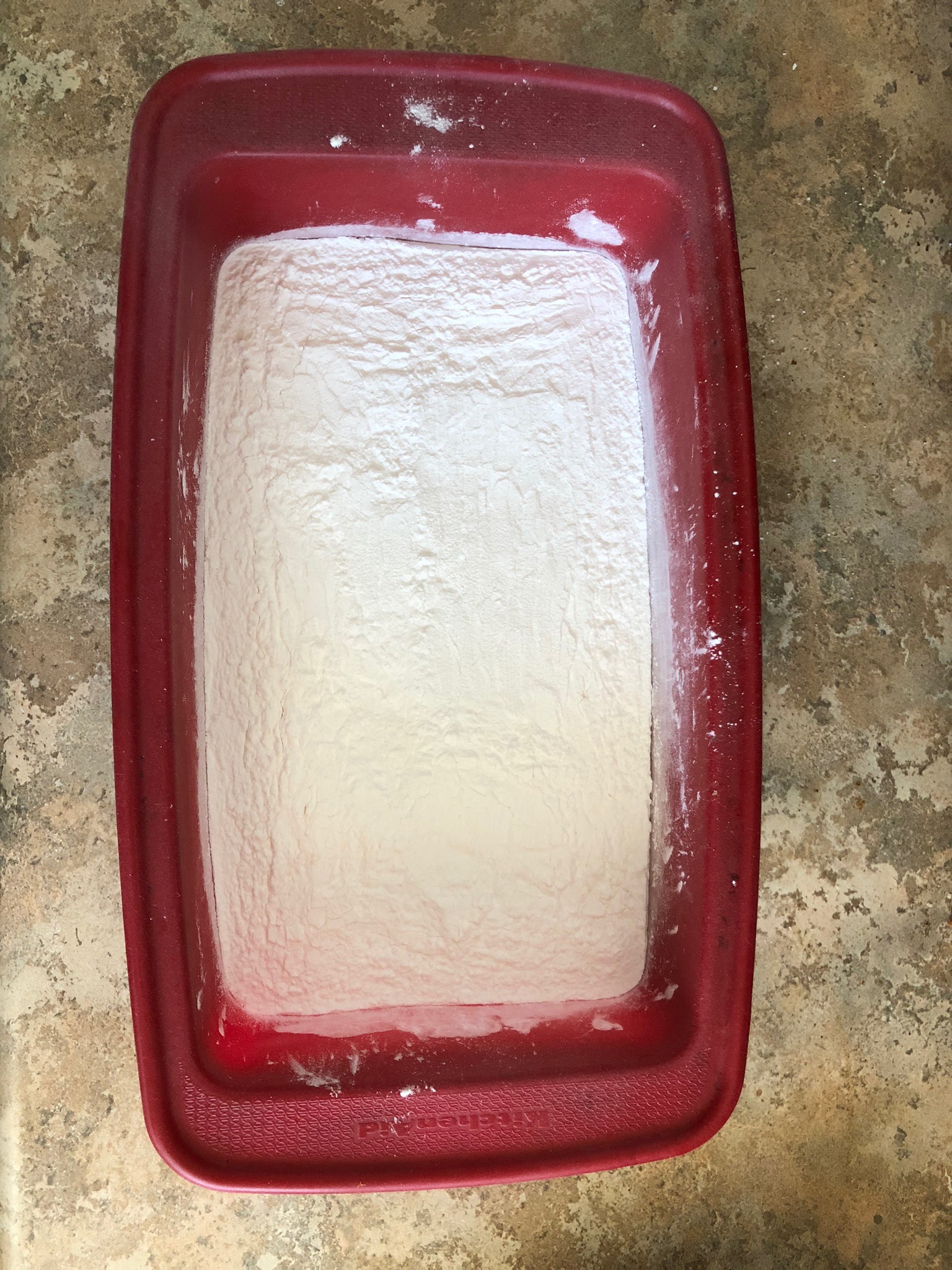 A silicone bread pan filled with flour